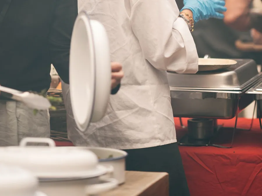 Chefs Preparing Food at Indoor Event