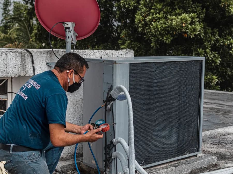 Man Checking an Air Conditioner