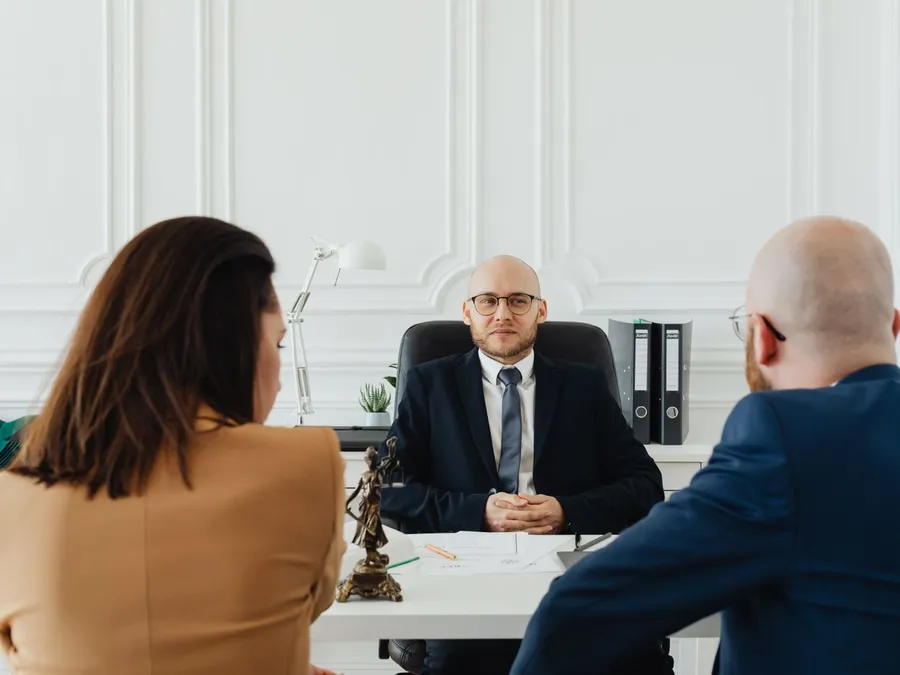 Clients meeting with a lawyer