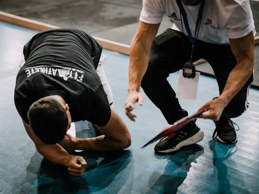 Man Exercising with a Trainer