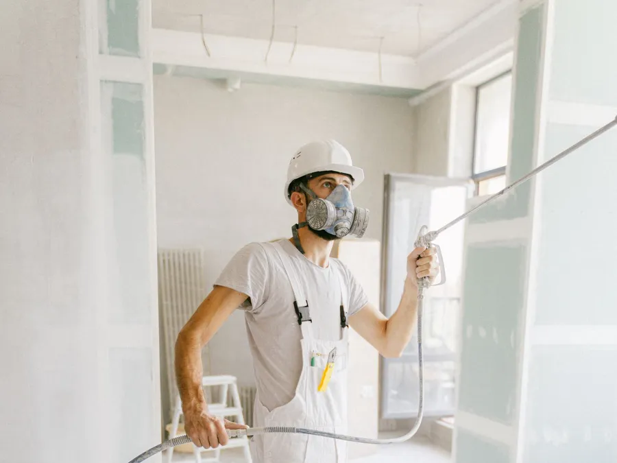 A Man Renovating a Home