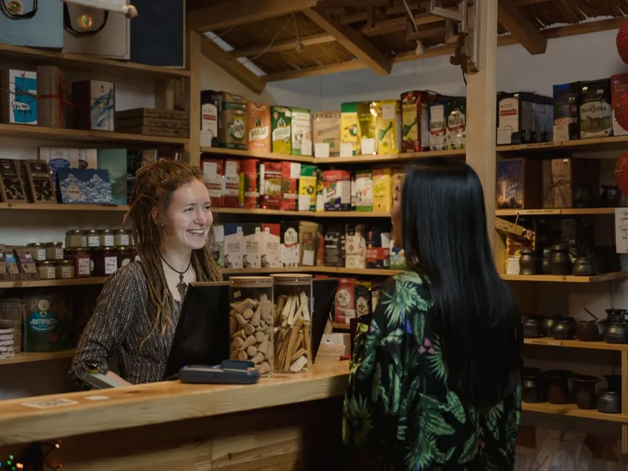 A Woman Talking to a Customer