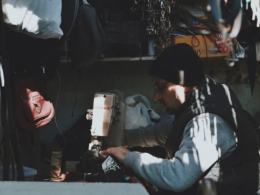 Tailor Working on Sewing Machine