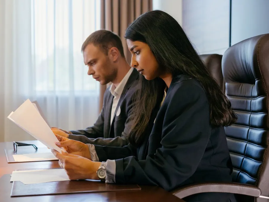 Professionals Looking at Documents