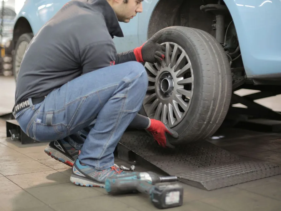 Man Changing a Car Tire